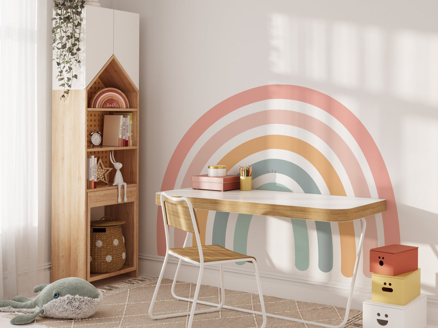 Large pastel rainbow wall decal behind a kids' study desk with wooden bookshelf — Tiny Tale Prints
